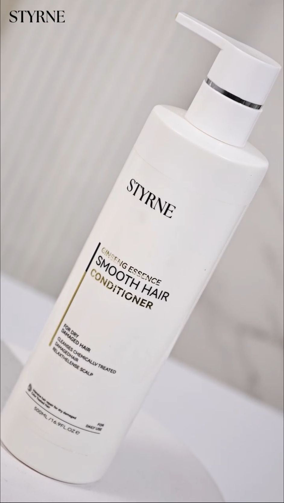 Styrne smooth hair conditioner bottle on a white background