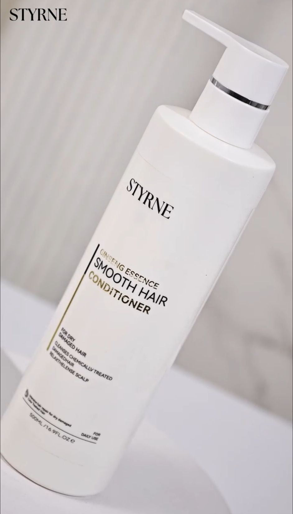 Styrne smooth hair conditioner bottle on a white background