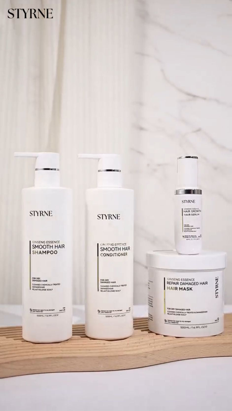 Set of Styrne hair care products on a wooden surface with a neutral background